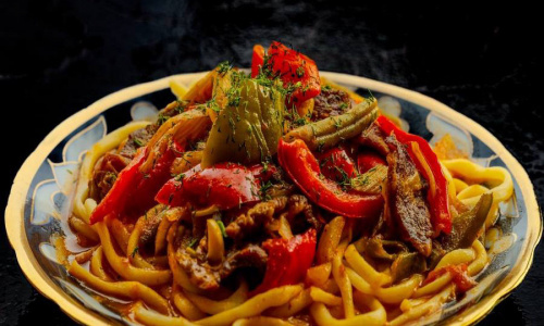 Lagman in vegetable and beef broth